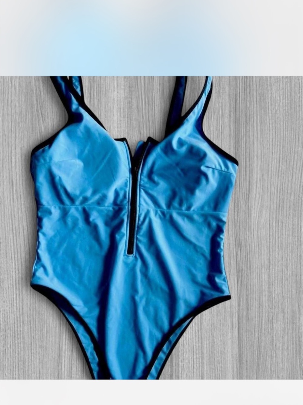 Sleek Blue Zip-Front One-Piece Swimsuit with Black Trim
